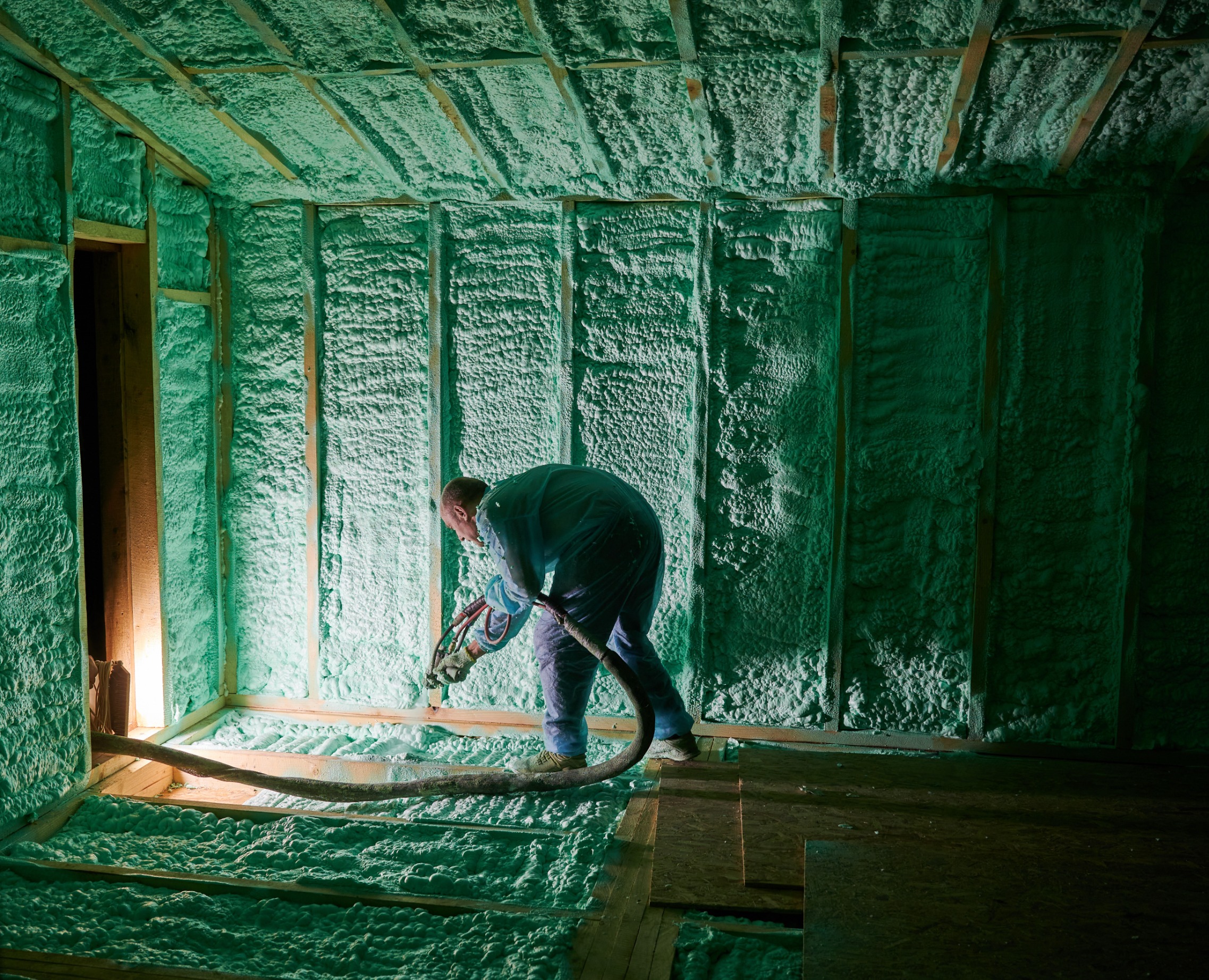 A worker insulating the house