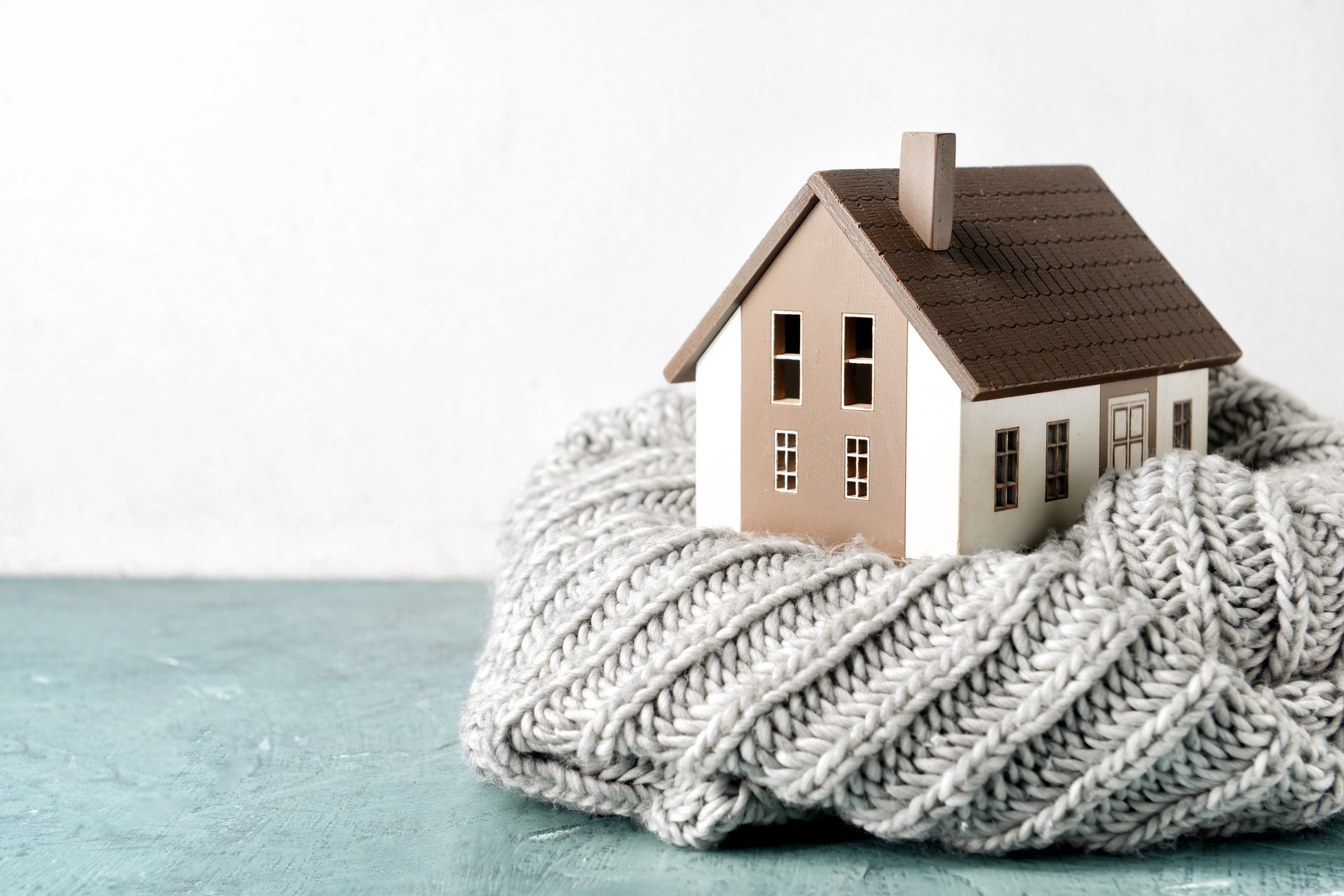 Home model covered with a woolen scarf