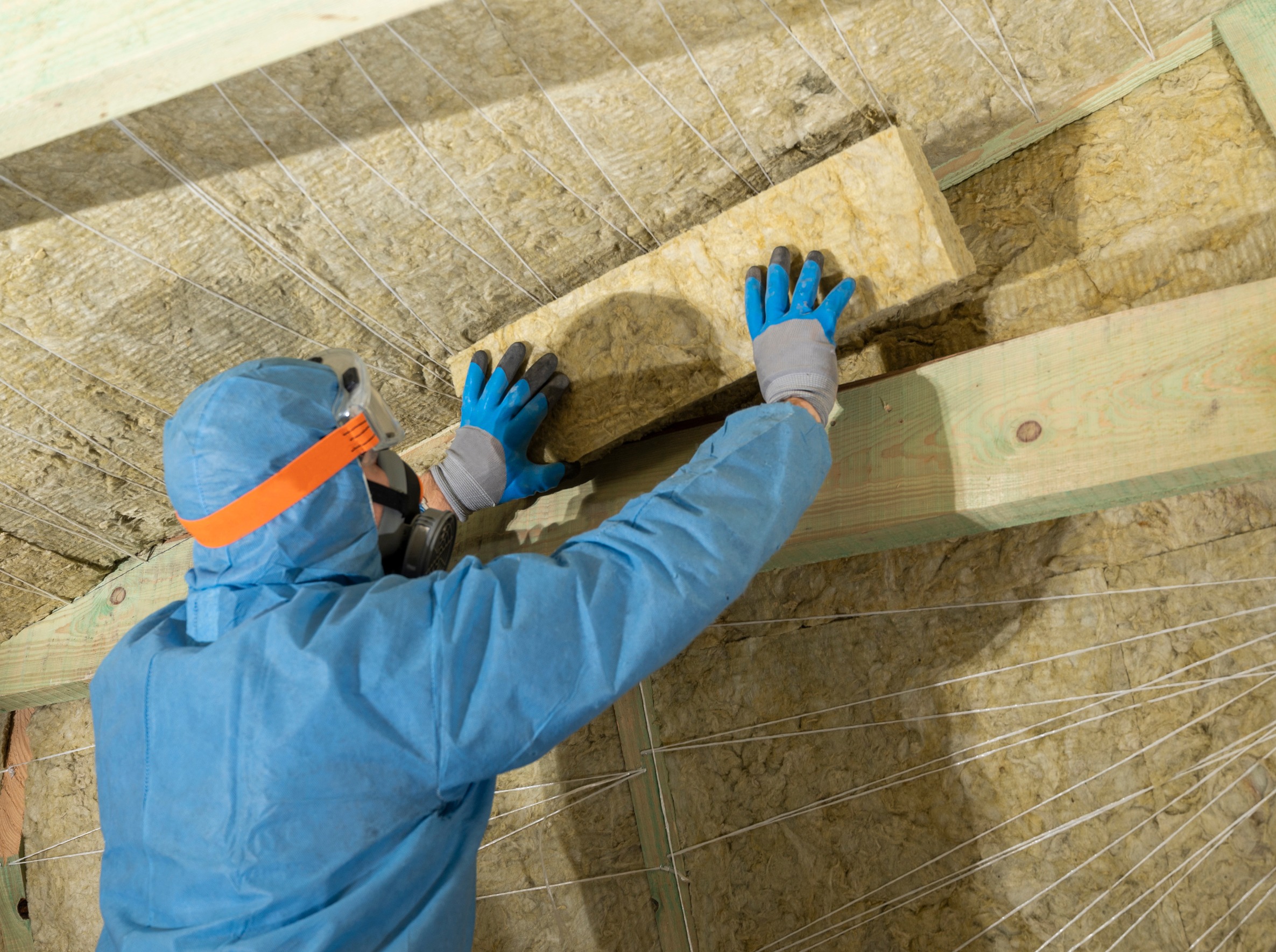 professional removing Asbestos containing insulation material